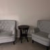 Two arm chairs with small table
