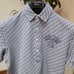 A white, short-sleeved polo shirt with navy floral print from the golf brand ZOY.