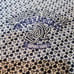 A white, short-sleeved polo shirt with navy floral print from the golf brand ZOY.