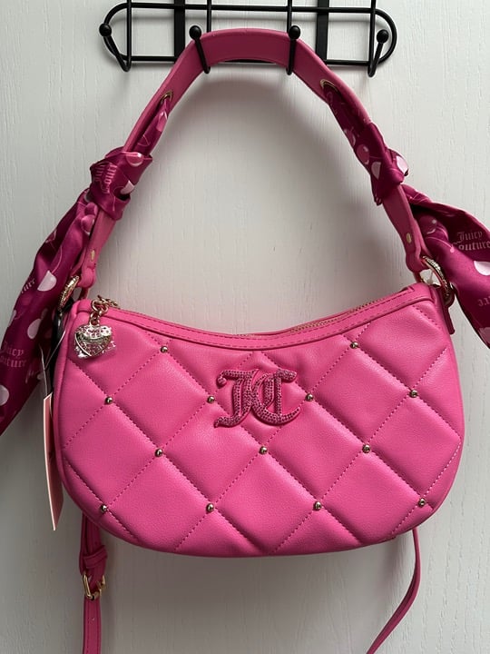 Juicy Couture holding the Line Coho Bag