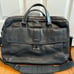 Tumi — black leather briefcase/shoulder bag — fits 15” laptop