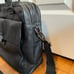 Tumi — black leather briefcase/shoulder bag — fits 15” laptop