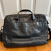 Tumi — black leather briefcase/shoulder bag — fits 15” laptop