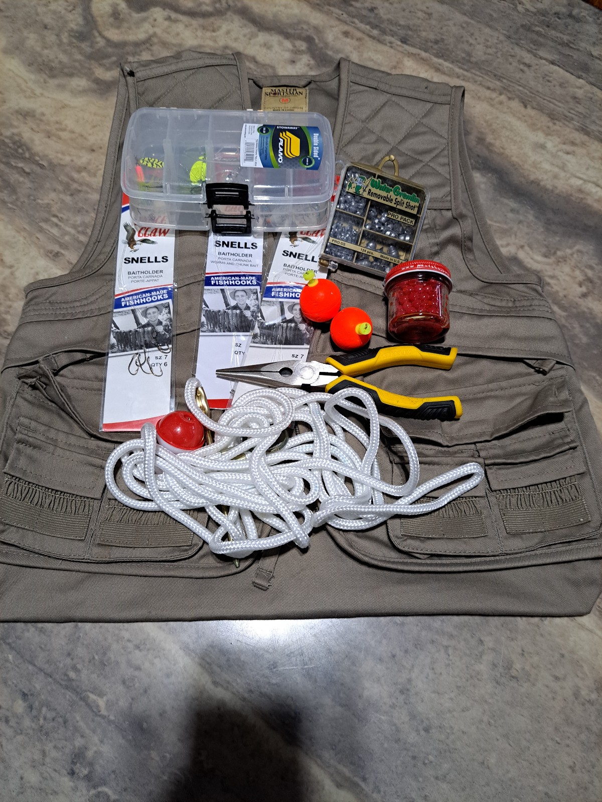 Children's fishing vest (medium) with fishing gear.
