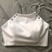 BEBE Grommet Bare Shoulder Halter Top