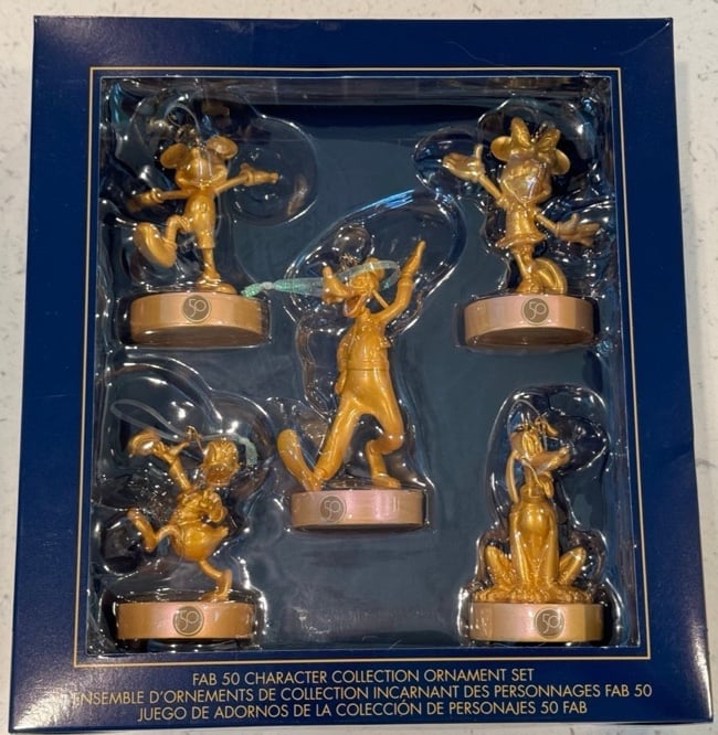 NWT. boxed collection of five of these golden Disney Fab 50 character ornaments