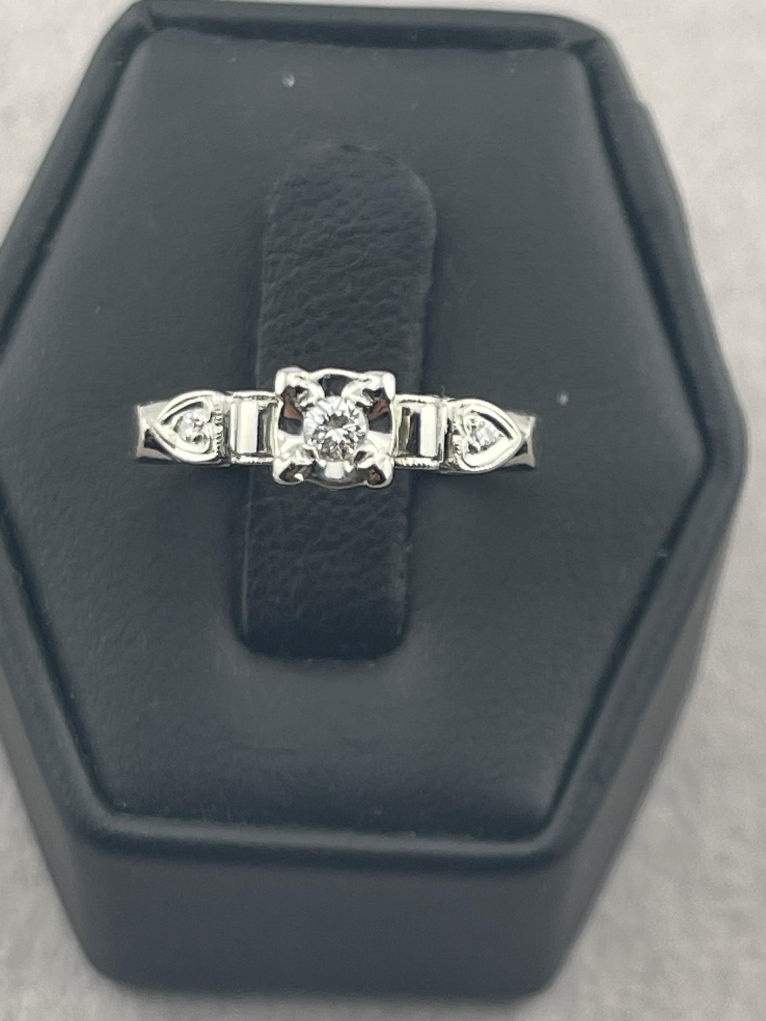 Antique quarter carat diamond engagement ring 14 karat white gold