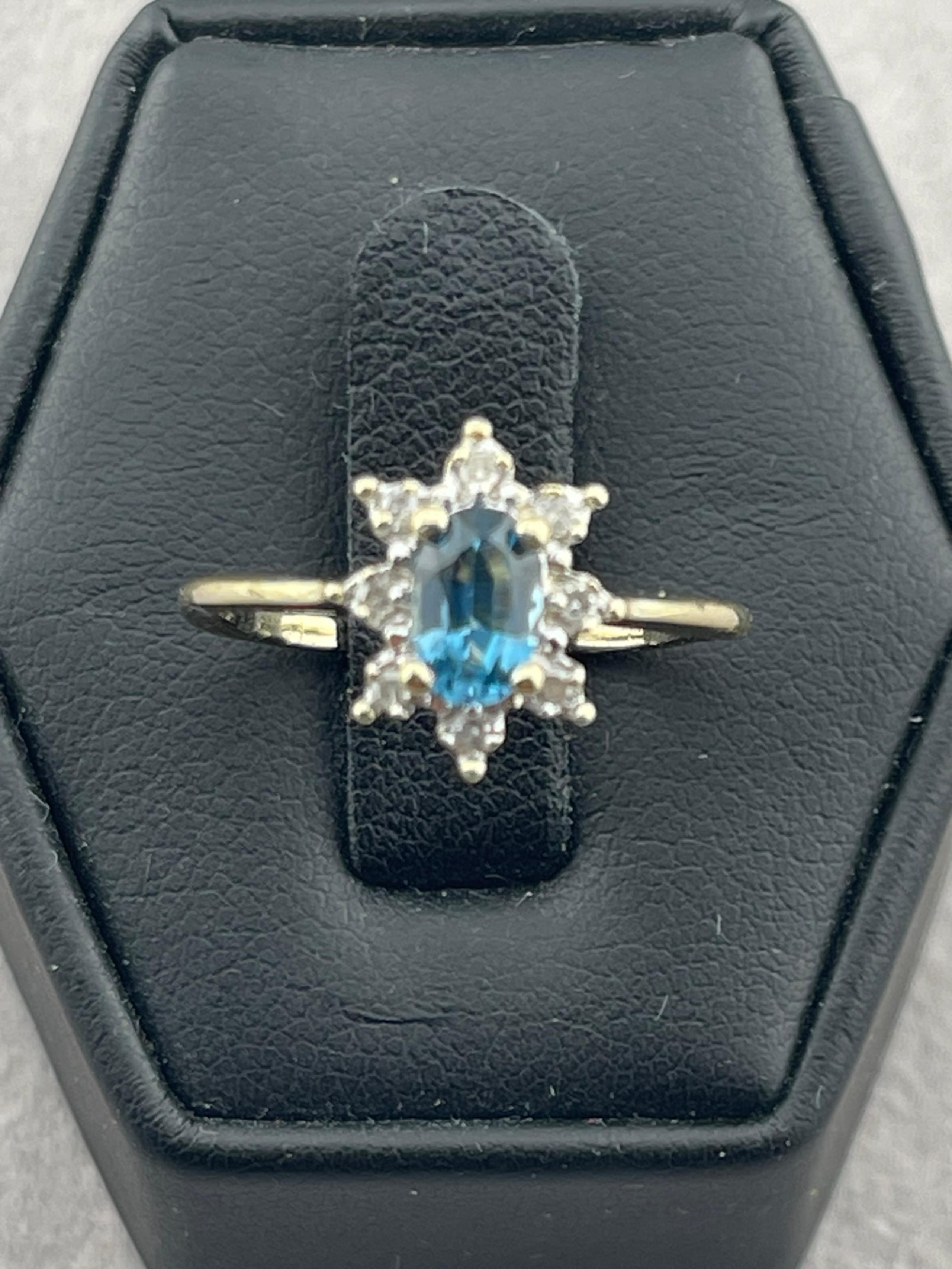 Vintage London, blue topaz halo diamond ring, 10 karat yellow gold