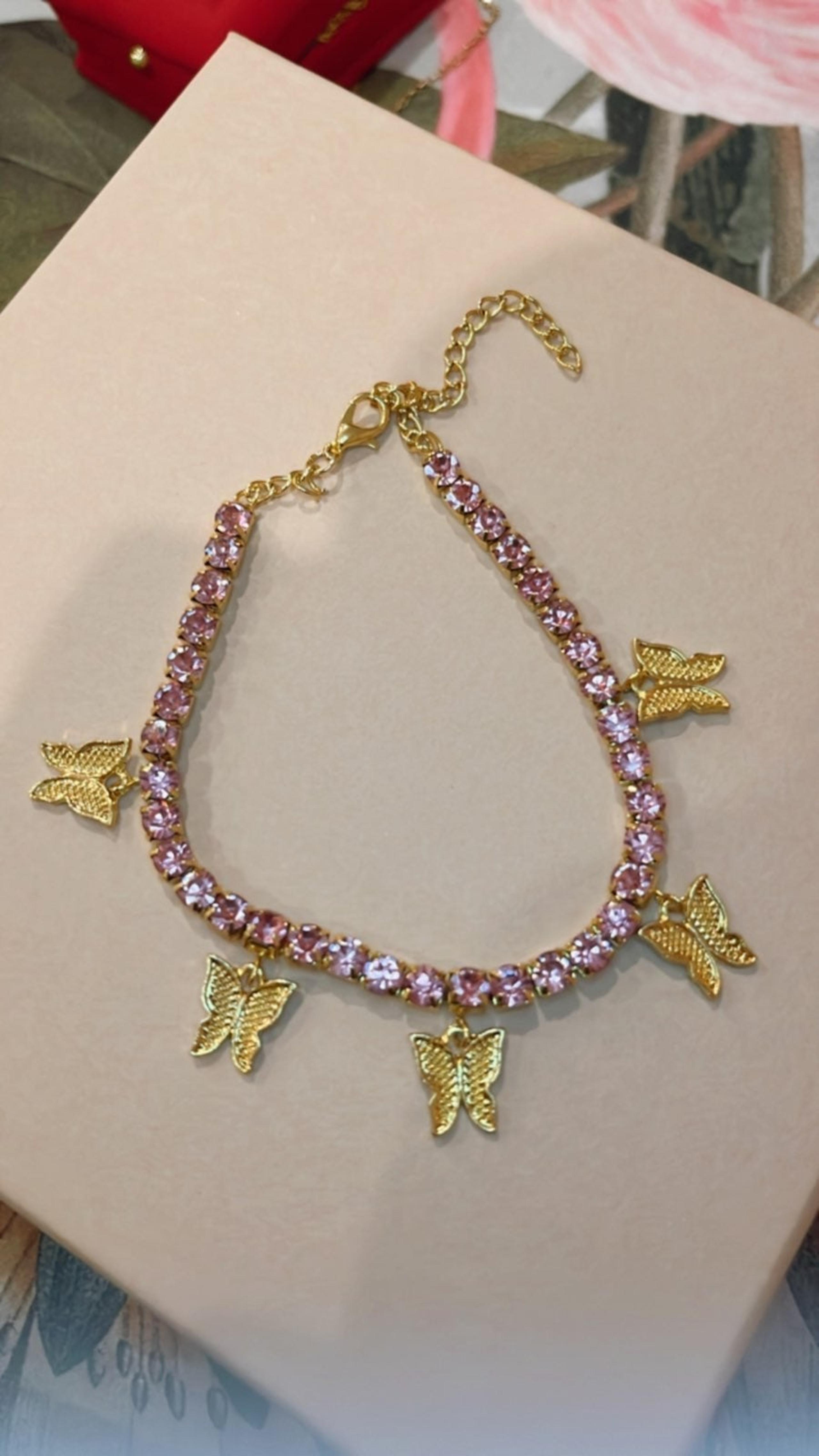 butterfly necklace gold + pink rime stones.