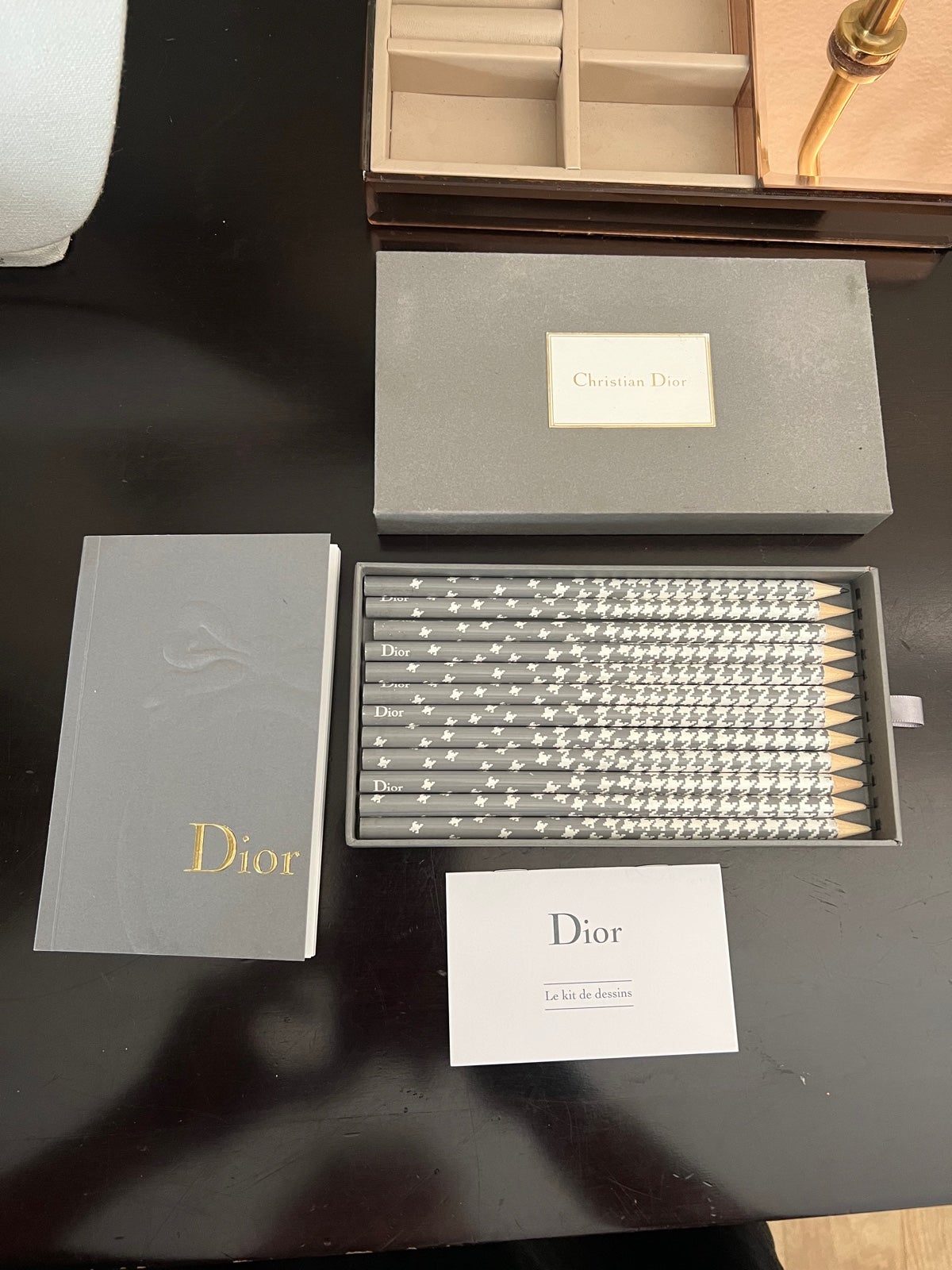 Dior pencils with case and a notebook