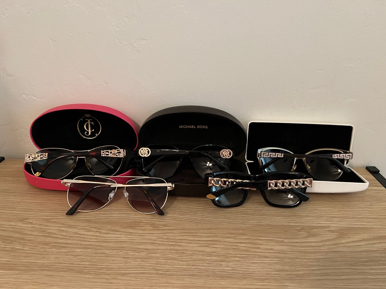 Five pairs of sunglasses Versace Juicy Couture Michael Kors