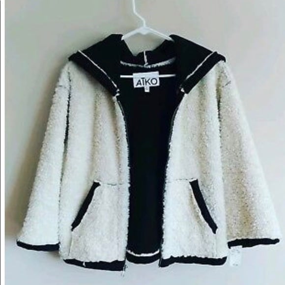 Anthropologie AIKO ivory and black faux shearling.