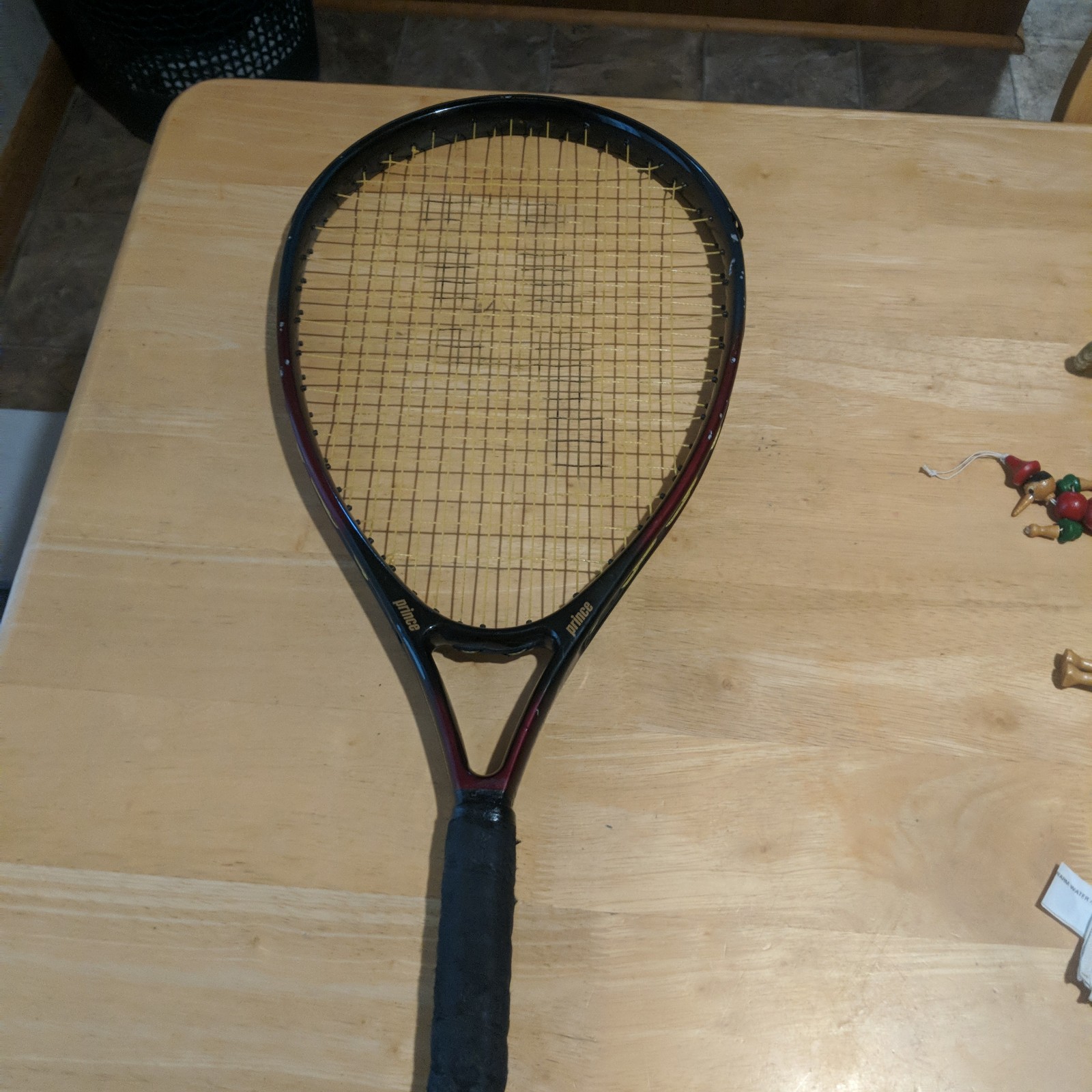 (1) used tennis racquet. There are scratches and other blemishes