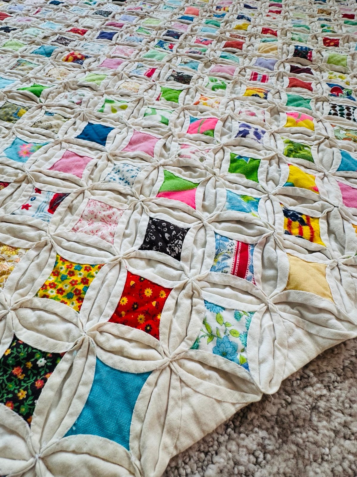 Handmade cathedral window quilt