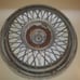 One Oldsmibile Delta 88 Custom Cruiser wire hubcap 1980s