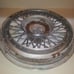 One Oldsmibile Delta 88 Custom Cruiser wire hubcap 1980s