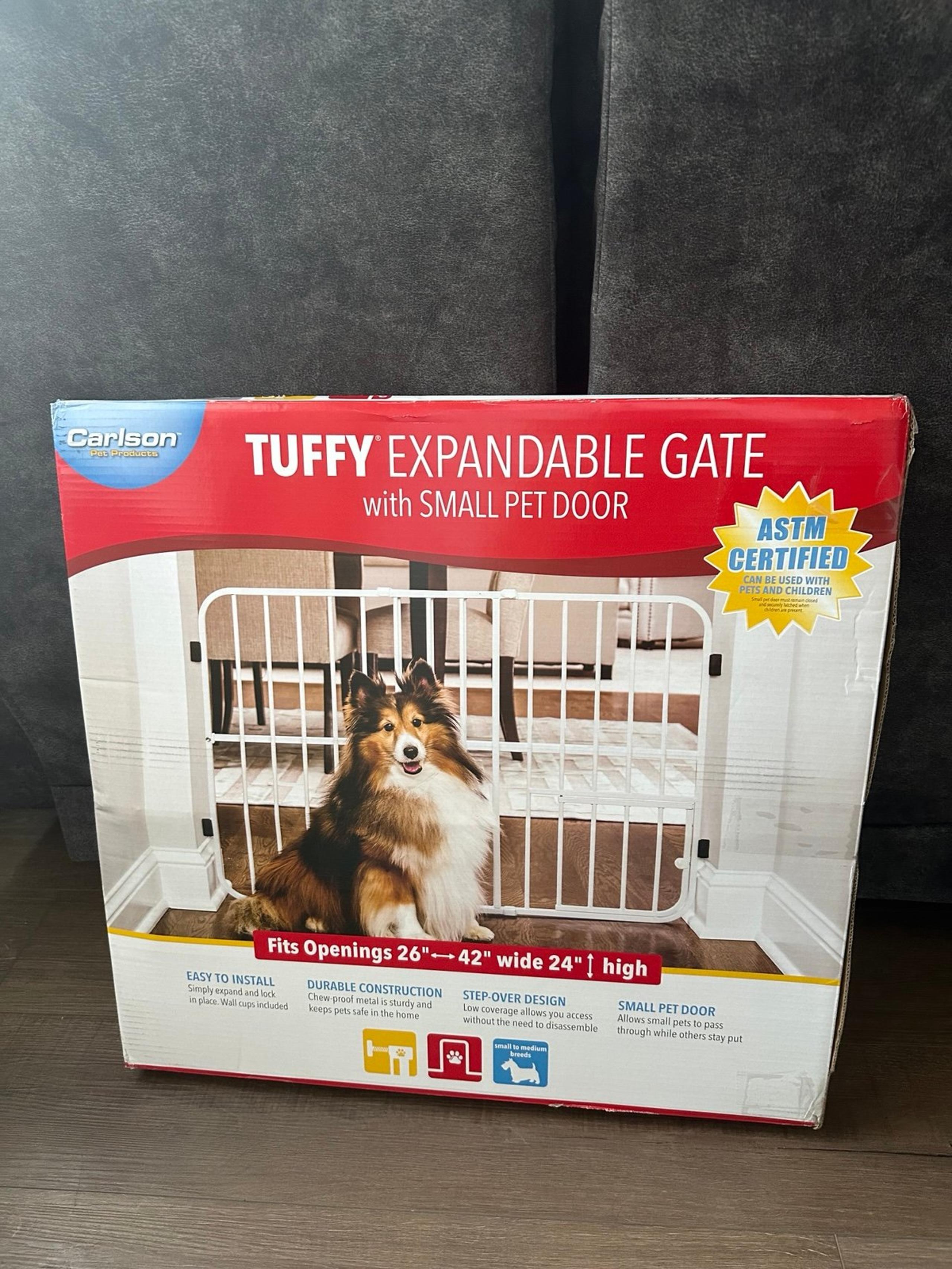 Pet/baby gate with a small pet door