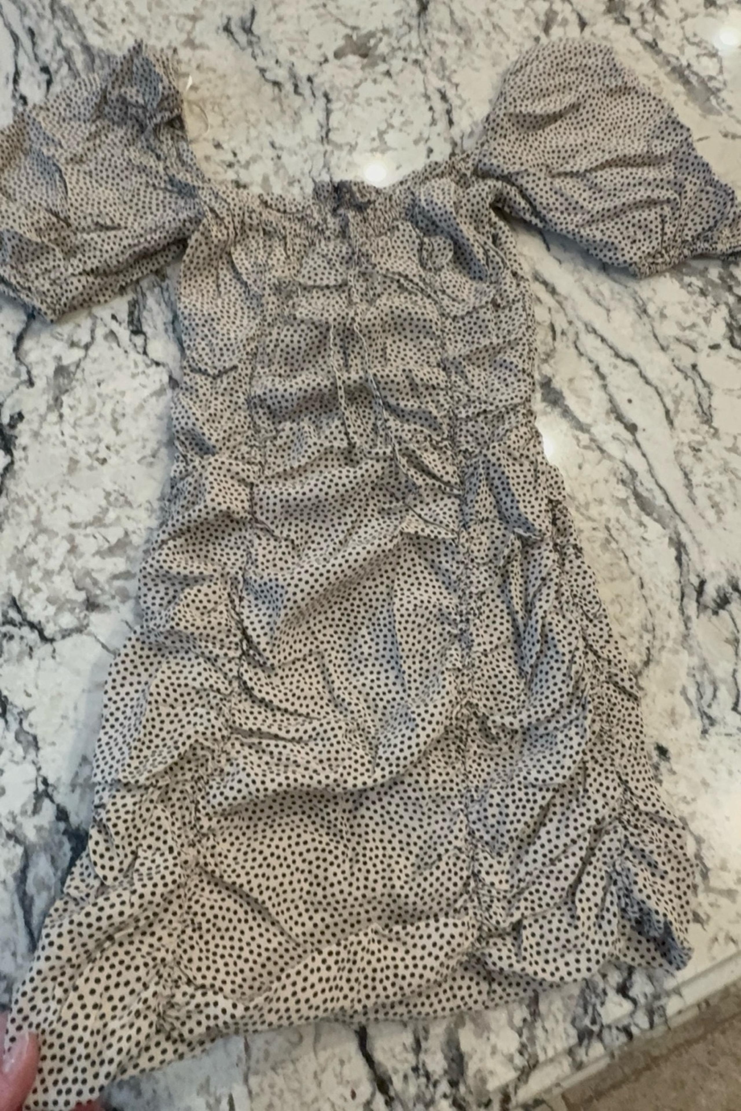 Gently worn women’s ZARA size XS tan and black dotted ruched lined dress.  Off t