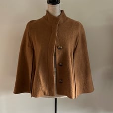 Chicos size 3 cape in a tan color & leopard print lining. Some damage on collar