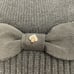 Kate Spade grosgrain bow beanie Black with gold spade & bow OS stretch New NWT