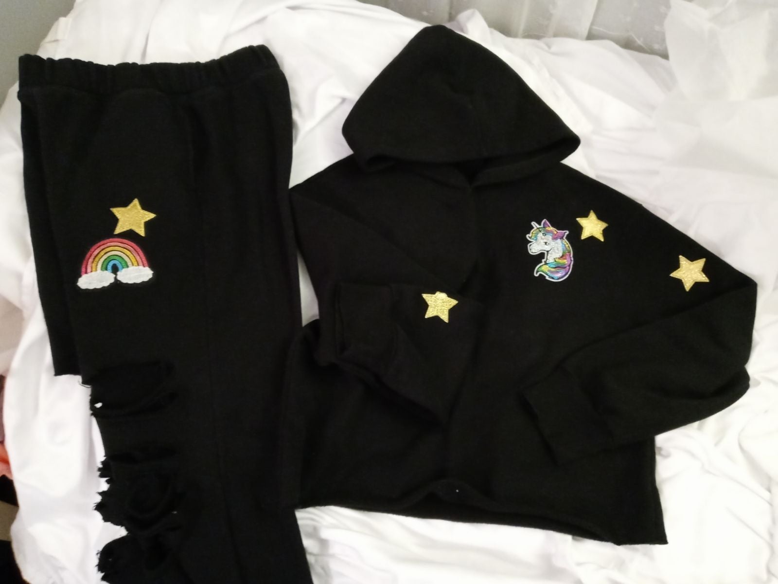 Black women's, juniors, sweat suit with pockets in the pants and a hoodie size