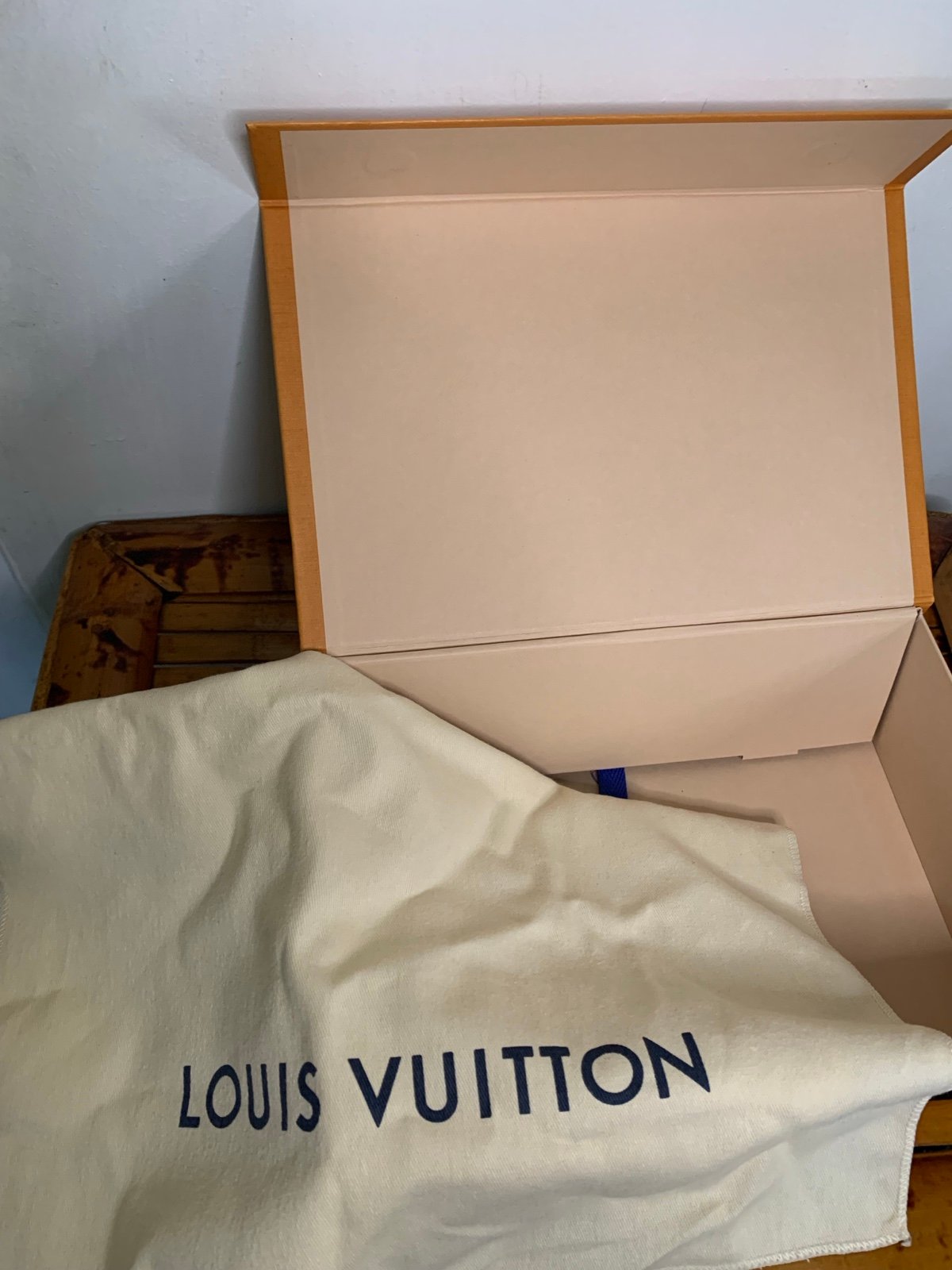 Louis Vuitton orange box with dust bag.