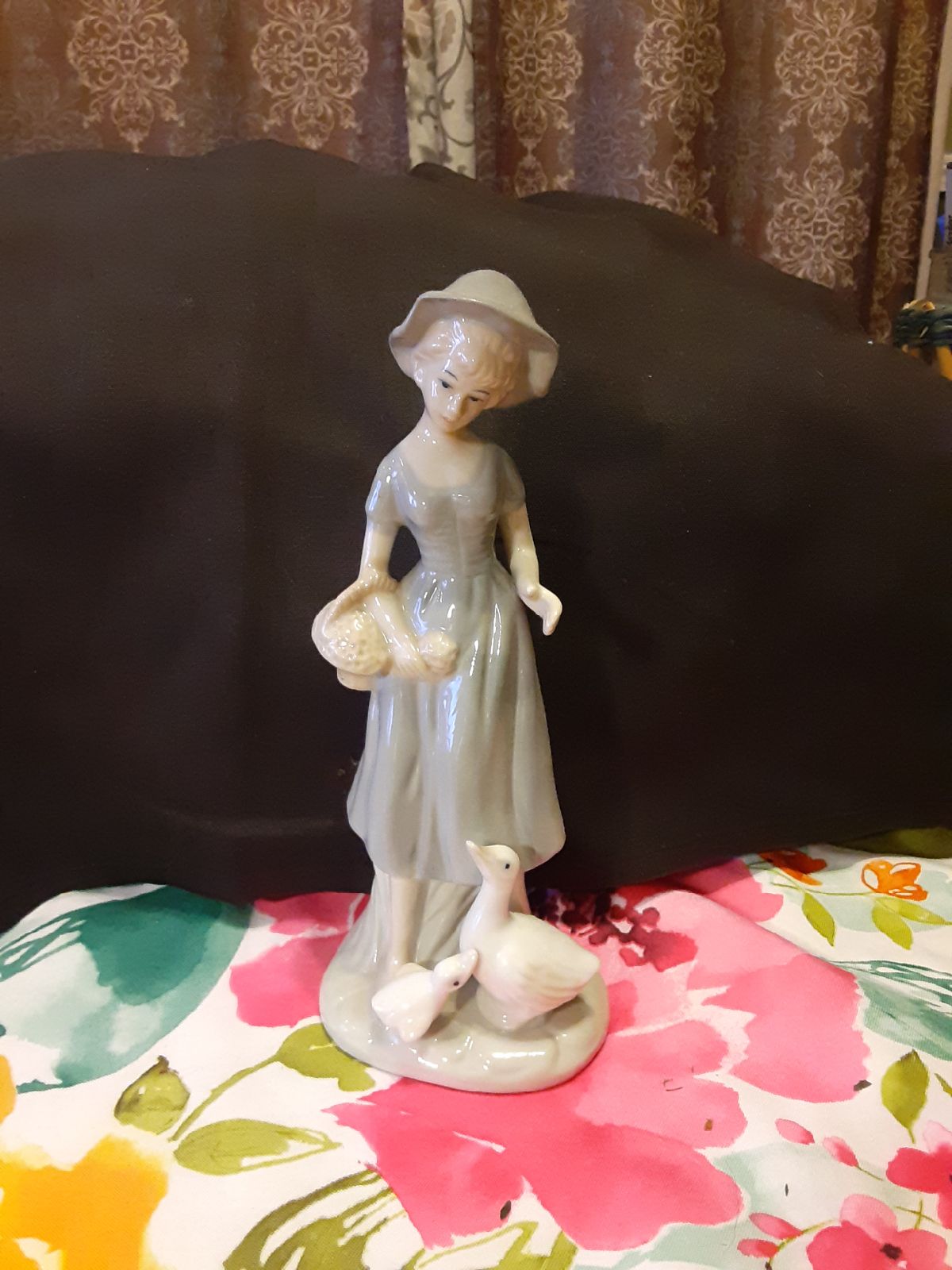 Lladro style looking girl with goose po
