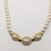 1980s Vintage Trifari Simulated Pearl Necklace with Clear Rhinestones Gold Tone