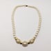 1980s Vintage Trifari Simulated Pearl Necklace with Clear Rhinestones Gold Tone