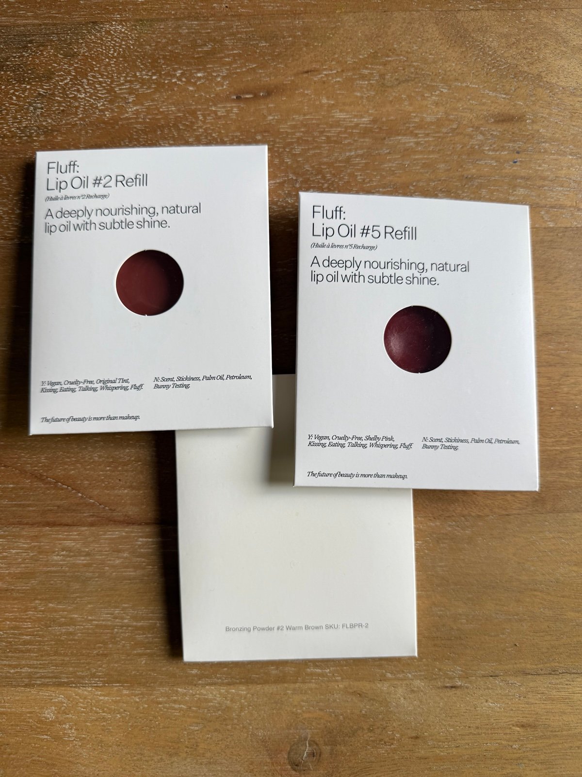 Fluff lip oil and bronzing powder refills