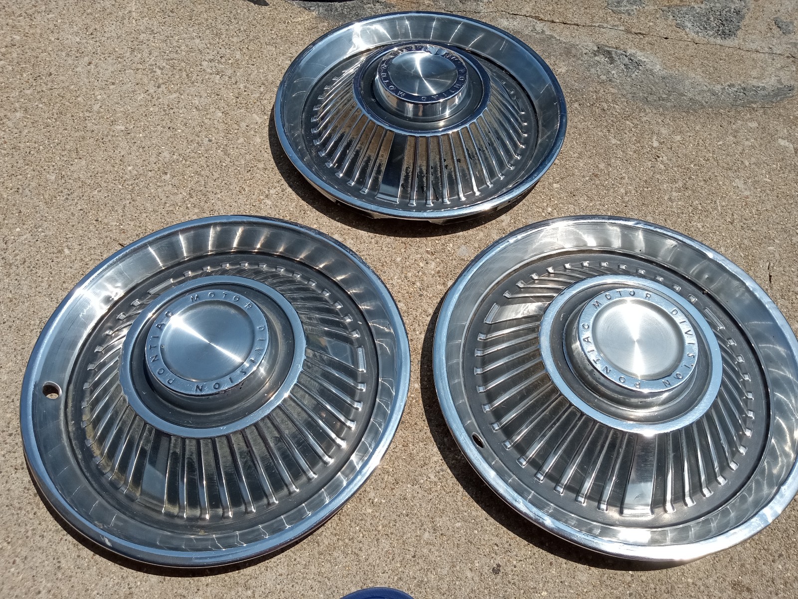 3-14 Pontiac motor division hubcaps