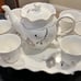 8 Piece China Tea Serving Set. Cups pitcher and raised tray for serving