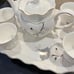8 Piece China Tea Serving Set. Cups pitcher and raised tray for serving