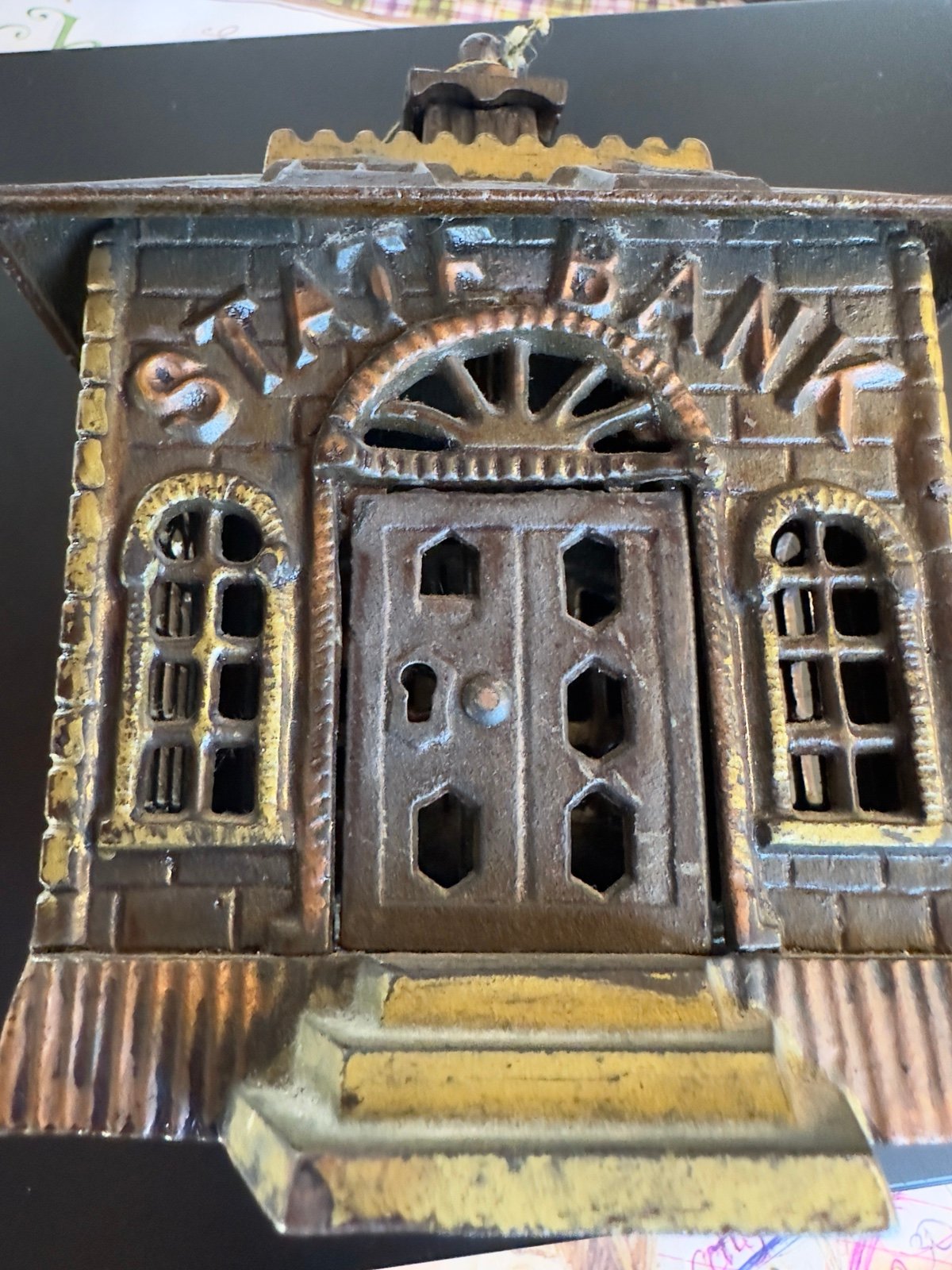 Antique Kenton Cast IRon State Bank with key. 6” tall, 3 3/4” wide 2 1/2” deep.