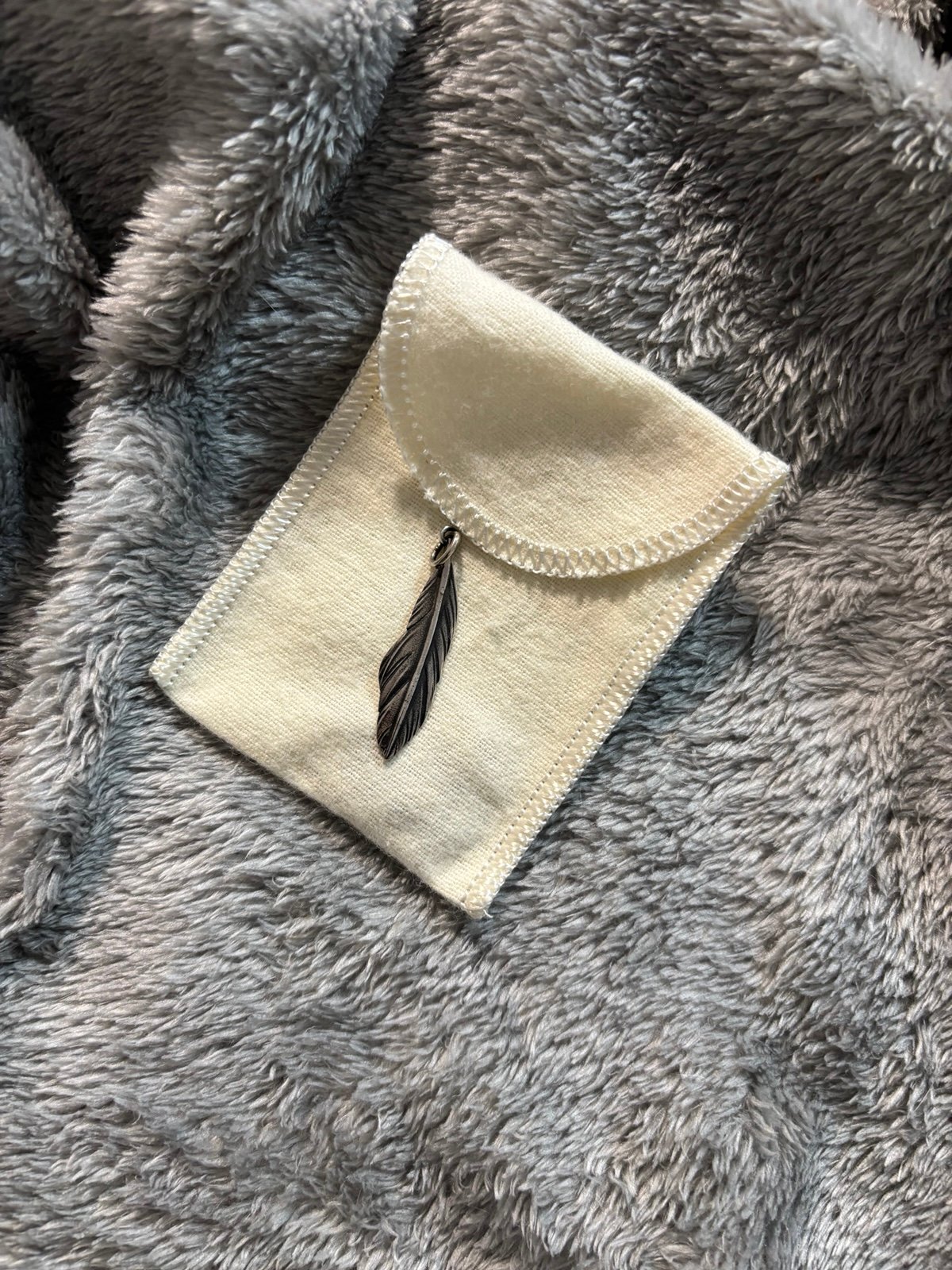 Feather charm retired