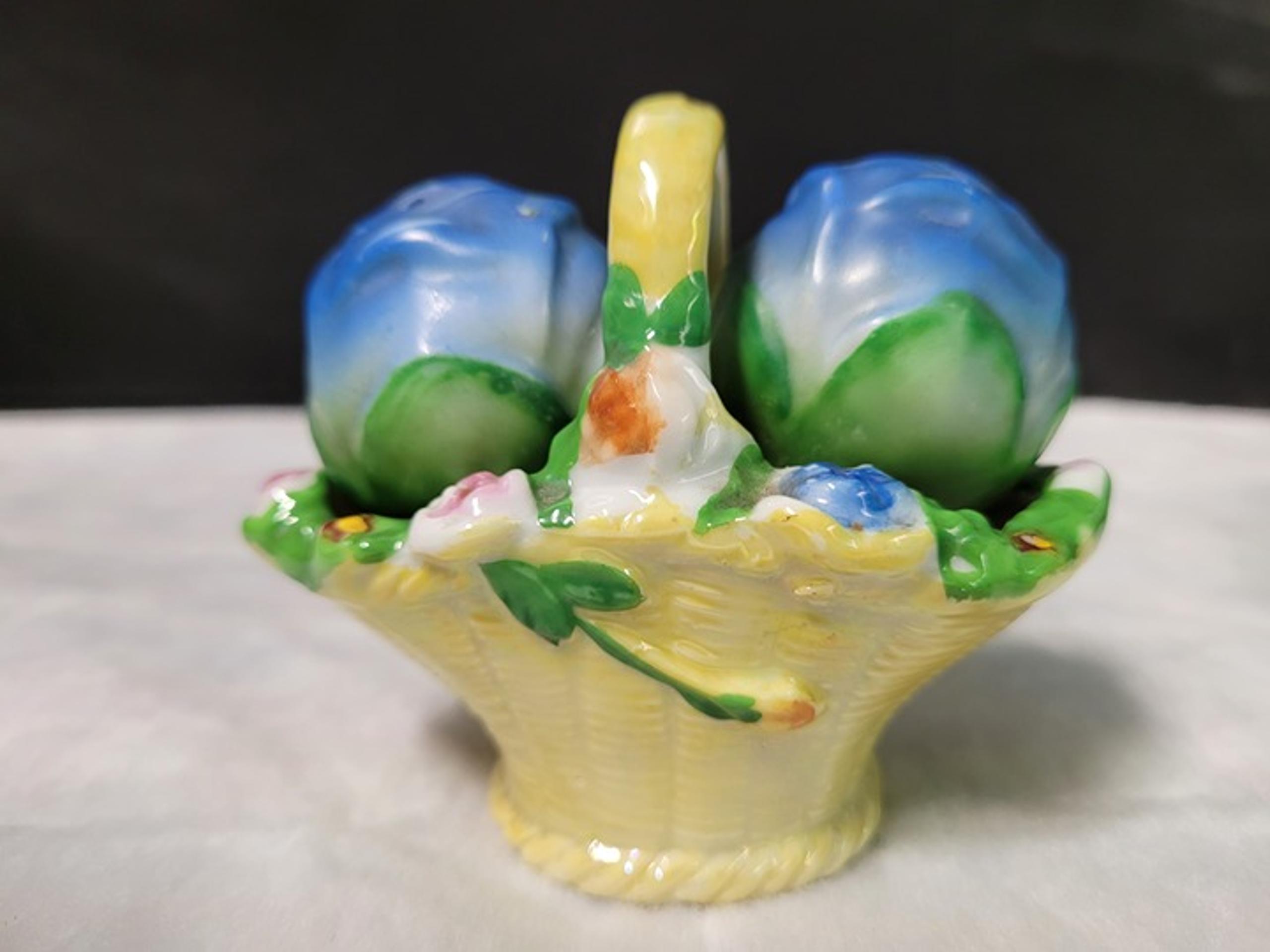 Vintage porcelain salt pepper shakers in basket Made in Japan