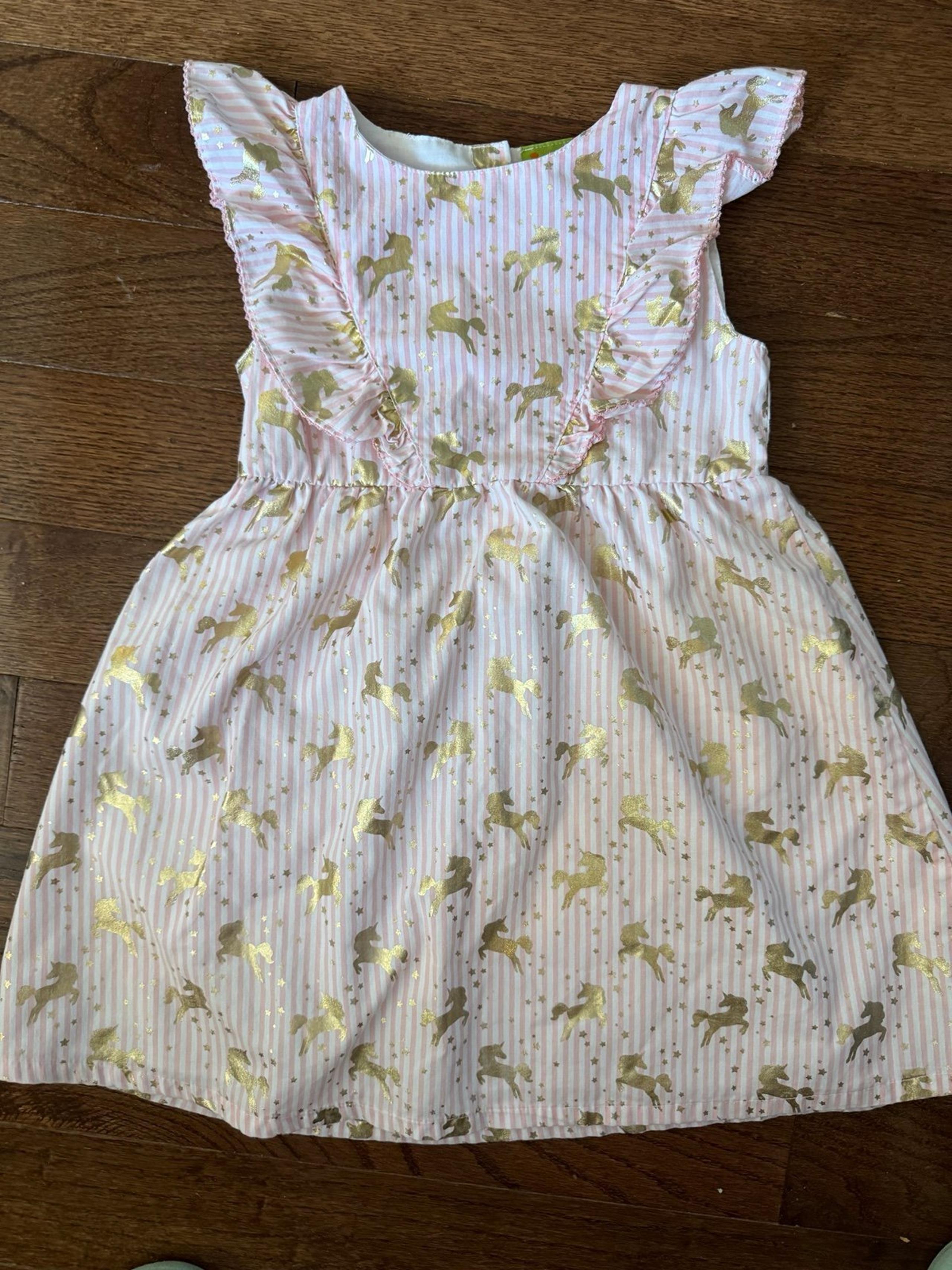 Penelope Mack pink striped dress with gold foil unicorns
