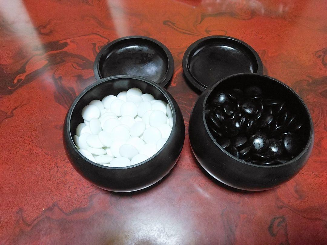 Glass Go Stones, Black and White, in a Container