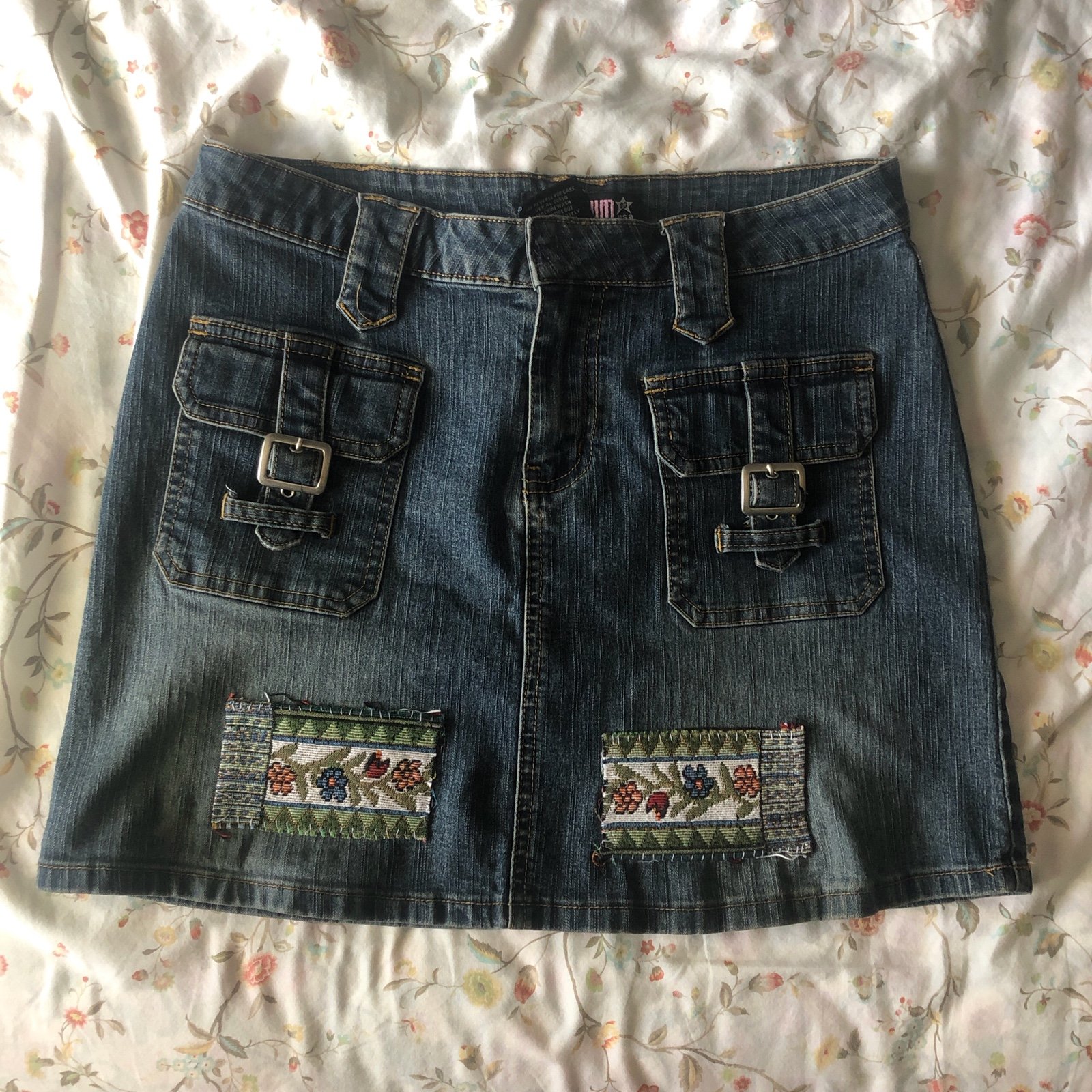 Upcycled Mini denim skirt with embroidered patchwork and buckle details