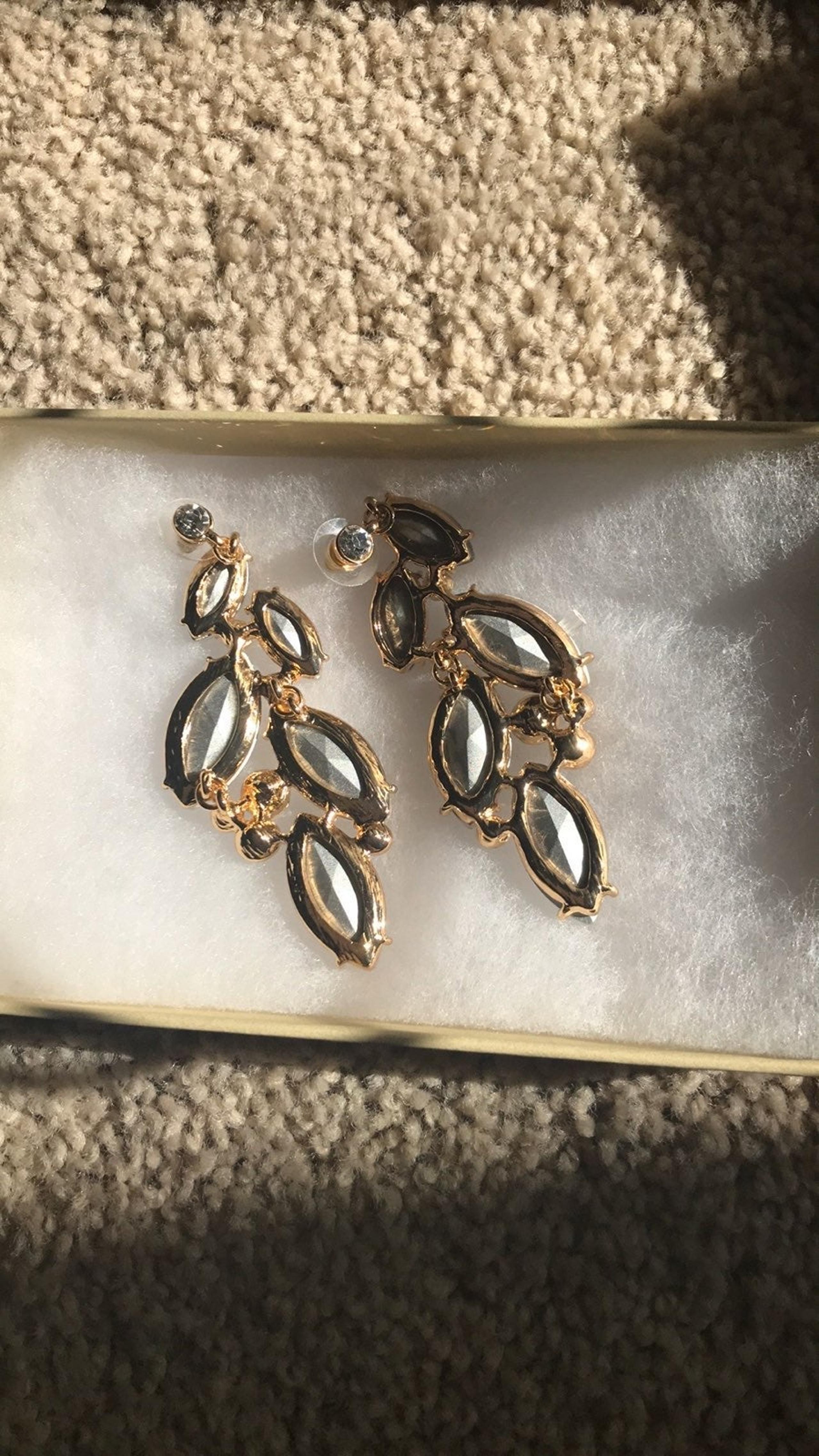 Bebe earrings for women
