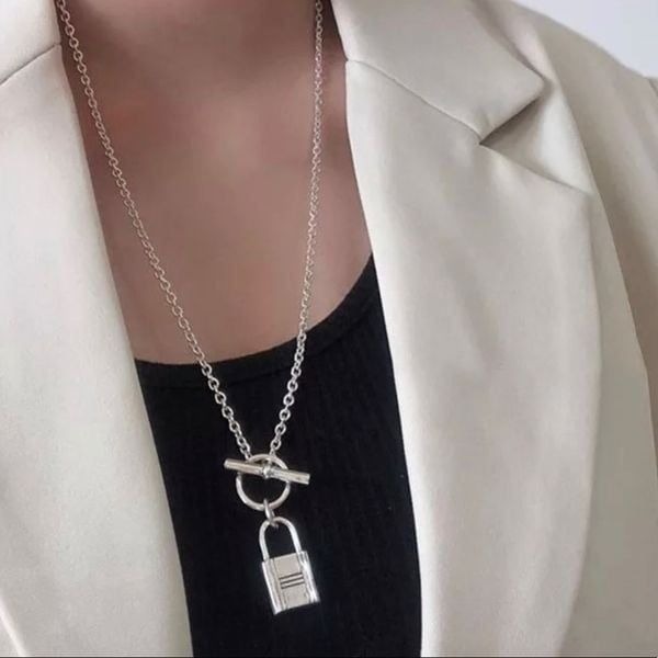 The Lock It Down Long silver necklace with lock and toggle closure