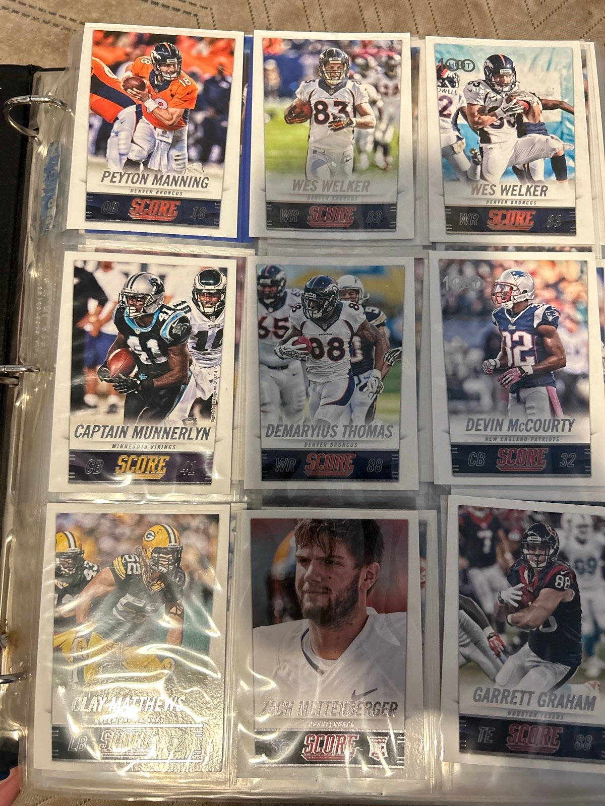 Binder of 28 pages of NFL trading cards