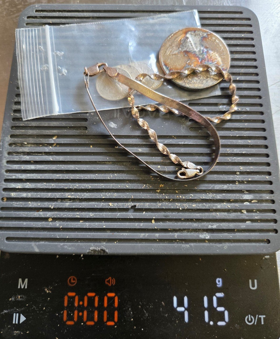 Mixed lot of scrap sterling silver and 90% silver coins, bracelets. 41.5 grams.
