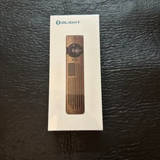 Olight Arkfeld UV Freedom Brass Edition Flashlight