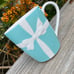 Tiffany and co. Coffee/tea cup teal cup white ribbon bow Japan made glass