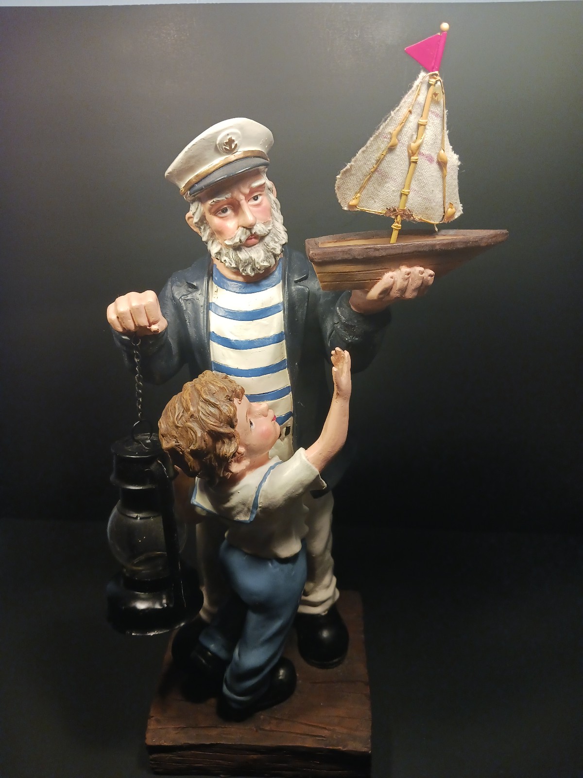 17 Sailor holding Lantern Child reaching 4Sailboat Ceramic Statue