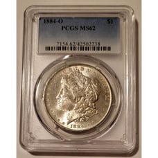 1884 O Morgan Silver Dollar MS62 PCGS Lightly Toned