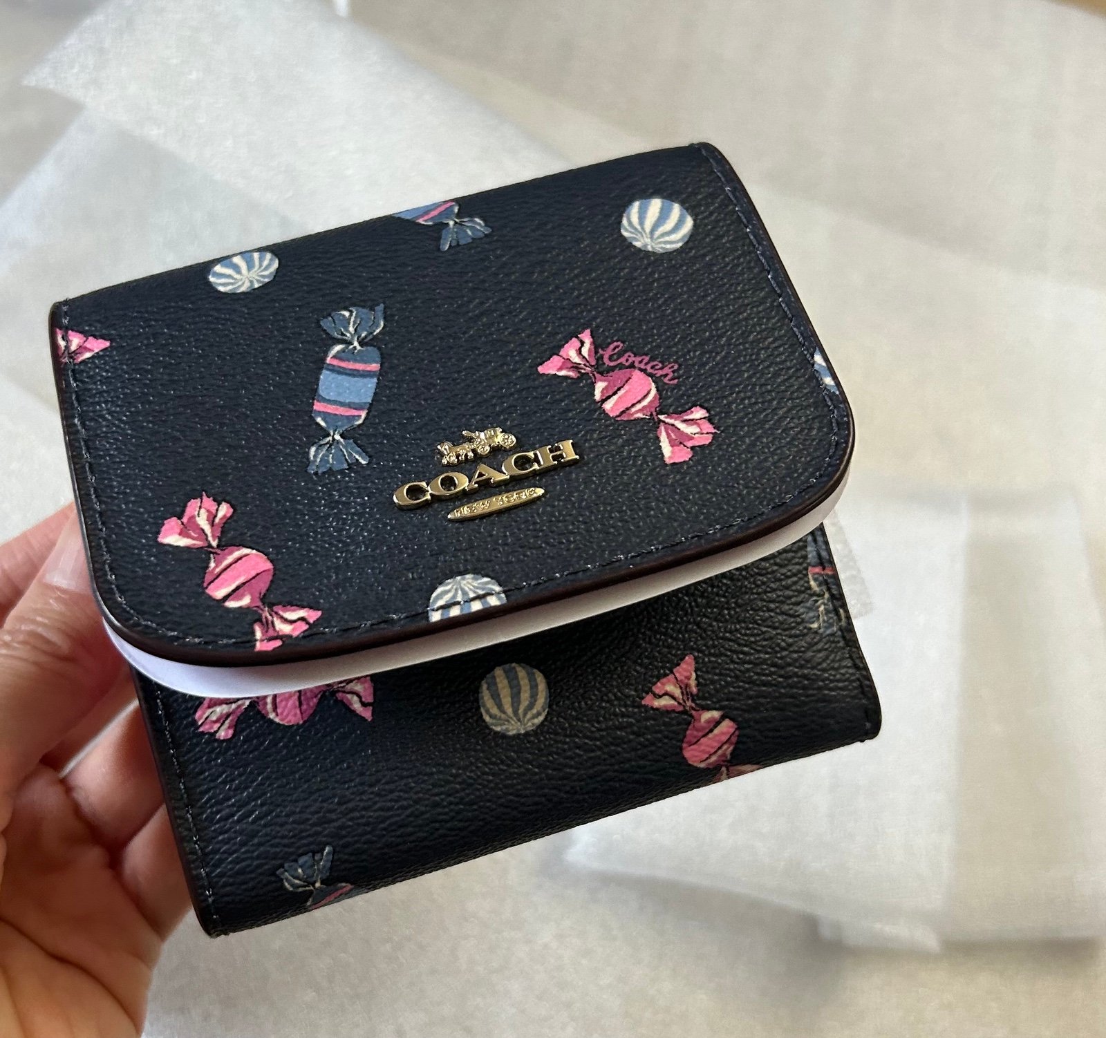 Coach small trifold wallet in scattered candy print