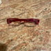 Red rimmed reading glasses