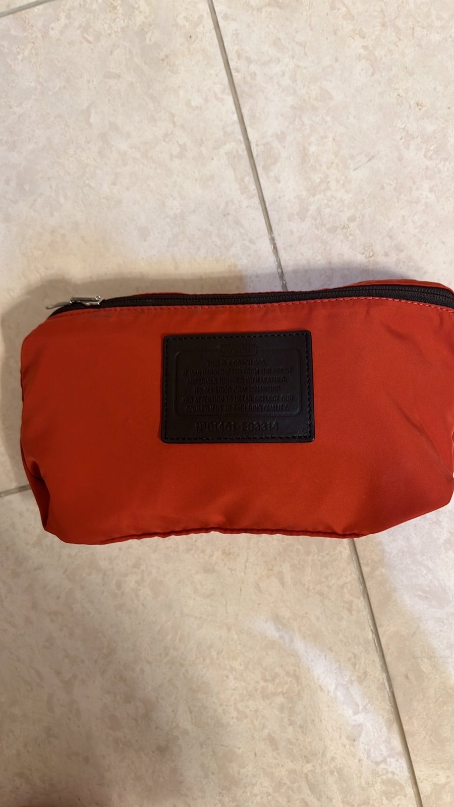 COACH foldable orange midium travel bag